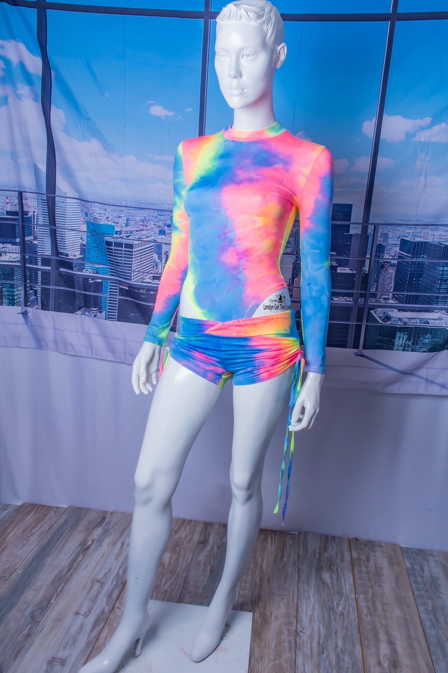 The most hottest and trendy fashion all in one outfit. Tie-Dye Bodysuit & Shorts Set, soft and comfy! Tie-Dye Featuring long sleeve bodysuit paired with drawstring side and scrunch butt booty sports shorts Detail V Neck A Combination To Die For