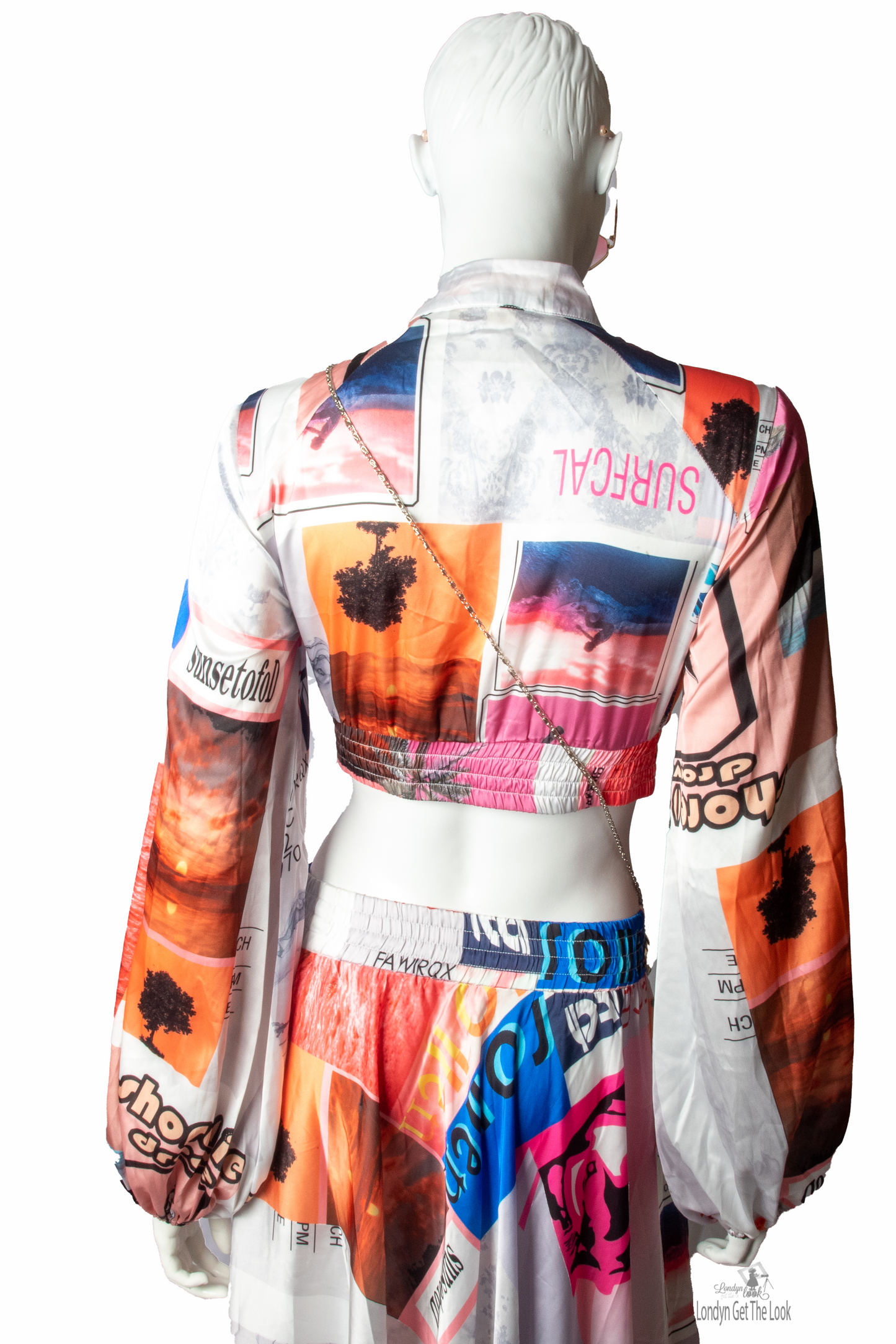 Long Sleeve Print Two Piece Set Top & Skirt featuring a button front top with pleated detail paired with matching dramatic flair maxi length skirt mock neck long puffy sleeve button-front closure with stunning shade of multi colors