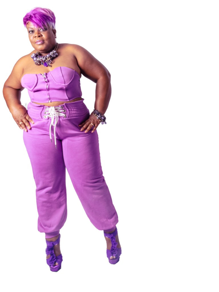 Jersey knit sets, two piece sets, lavender, bustier top paired with matching jogger pants featuring zipper closure at front, elasticated waist, waist shoe tie detail at front. Pair these matching sets with our Necklace from Londyn Jewels collection or Shady Londyn Sunglasses to get the look.