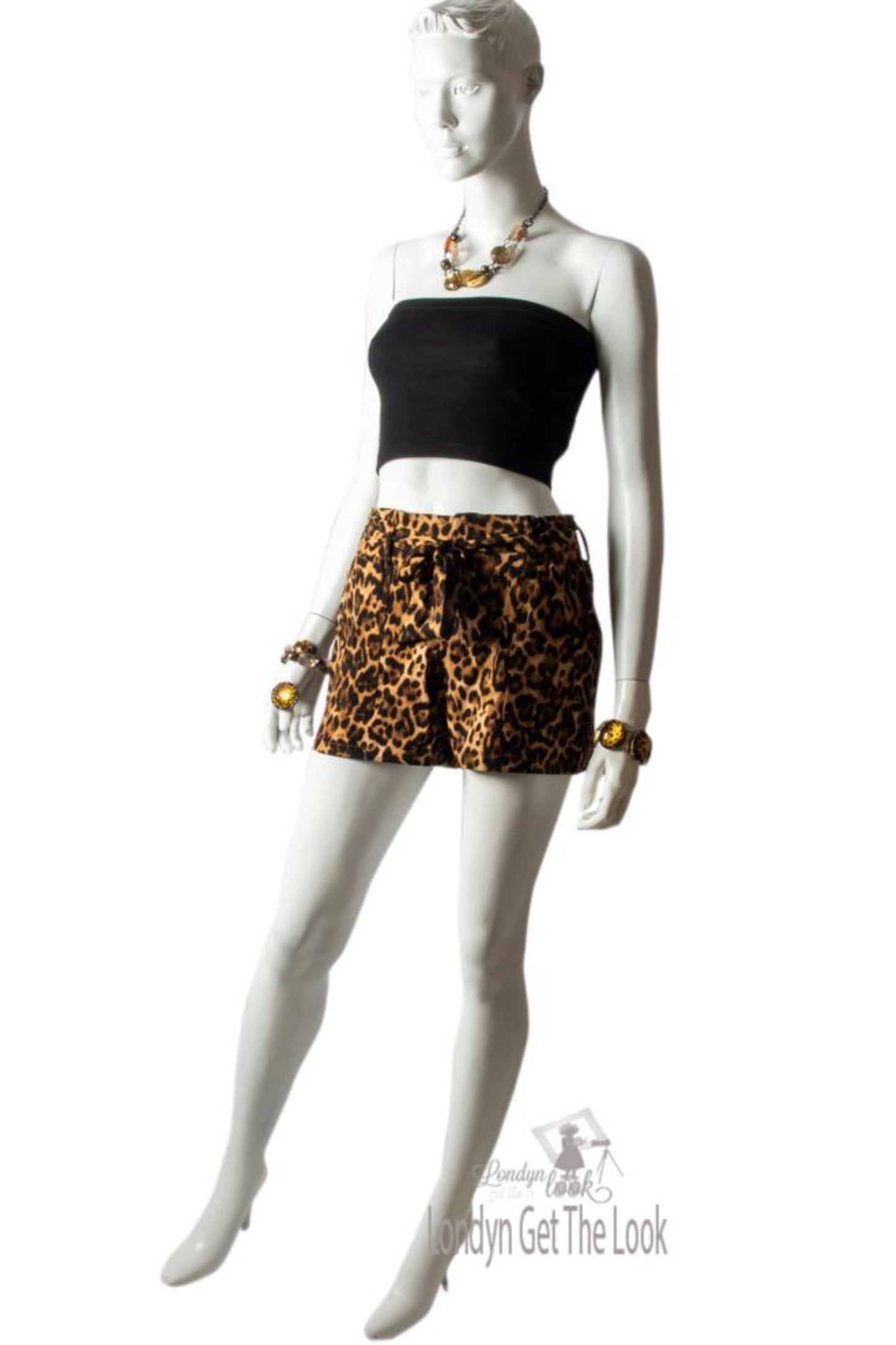 Leopard Print Blazer hip length with gathered up 3/4 sleeve has a collar side flap pockets hook to fasten or left open it also has a nice swing to it padded shoulder high rise shorts set elastic waist front zipper removable waist tie belt 2 Side slant pockets hook and eye closure