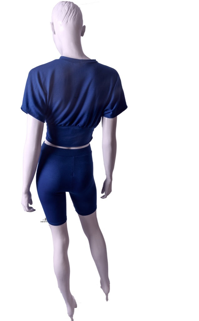 A Two-Piece Biker Short Sets featuring a corseted top and stretchy matching biker legging.
