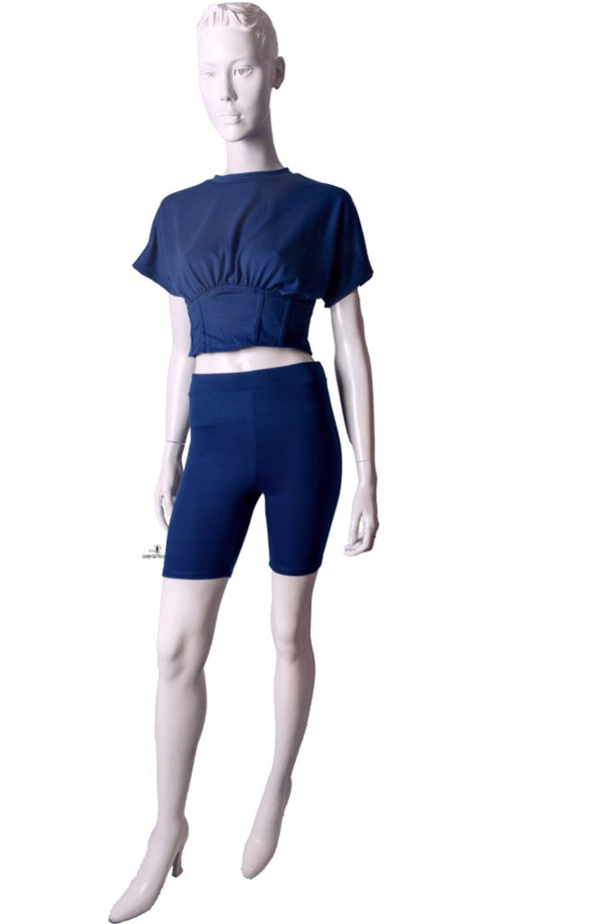 A Two-Piece Biker Short Sets featuring a corseted top and stretchy matching biker legging.