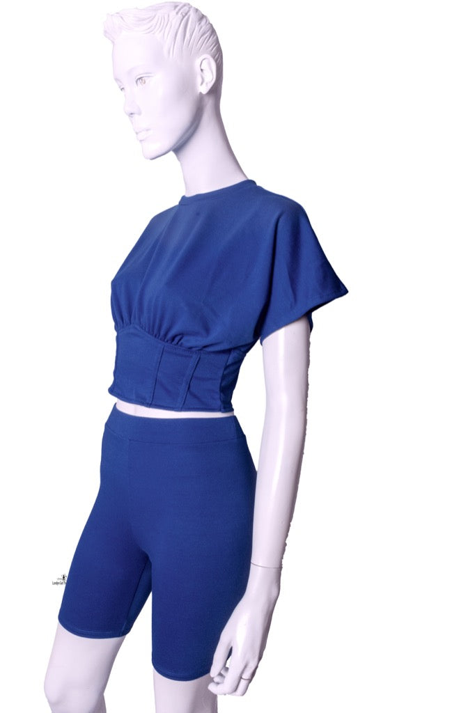 A Two-Piece Biker Short Sets featuring a corseted top and stretchy matching biker legging.