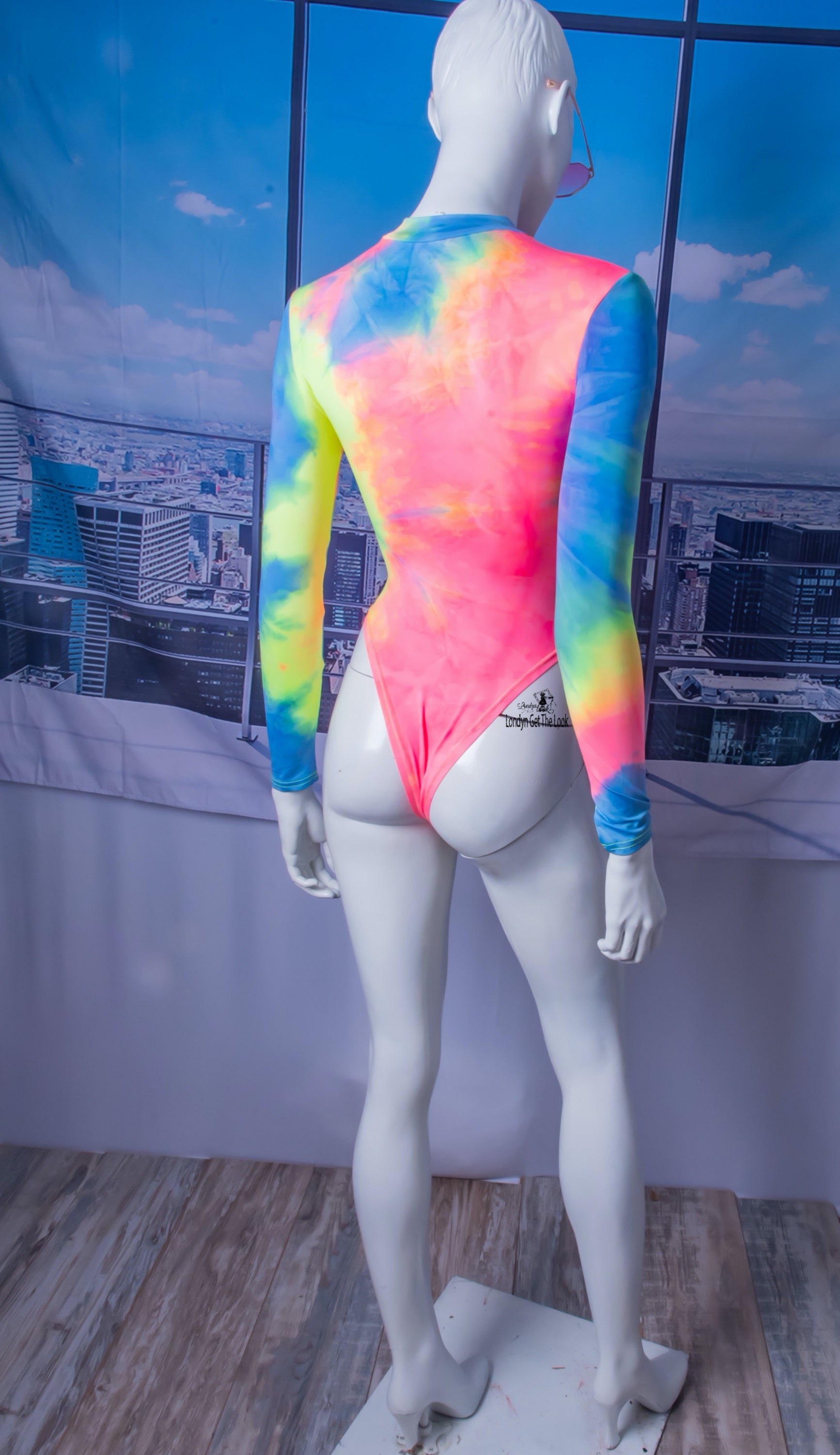 The most hottest and trendy fashion all in one outfit. Tie-Dye Bodysuit & Shorts Set, soft and comfy! Tie-Dye Featuring long sleeve bodysuit paired with drawstring side and scrunch butt booty sports shorts Detail V Neck A Combination To Die For
