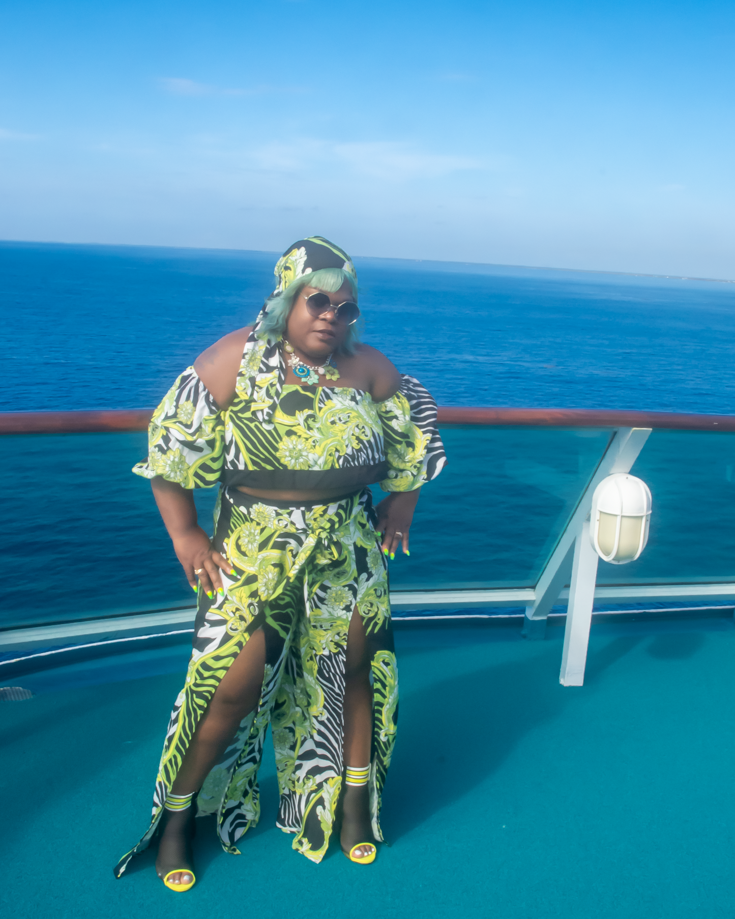 Off The Shoulder Zebra Print Romper Set 3/4  puffy sleeves with elastic, high waist, high slit flare pants showing off your sexy legs. also a matching head wrap, Neon Colors with Animal Prints.