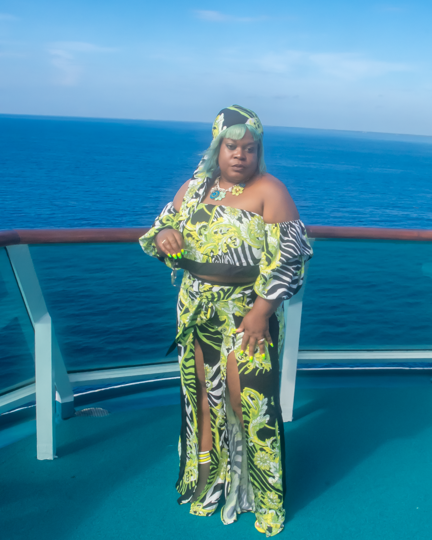 Off The Shoulder Zebra Print Romper Set 3/4  puffy sleeves with elastic, high waist, high slit flare pants showing off your sexy legs. also a matching head wrap, Neon Colors with Animal Prints.
