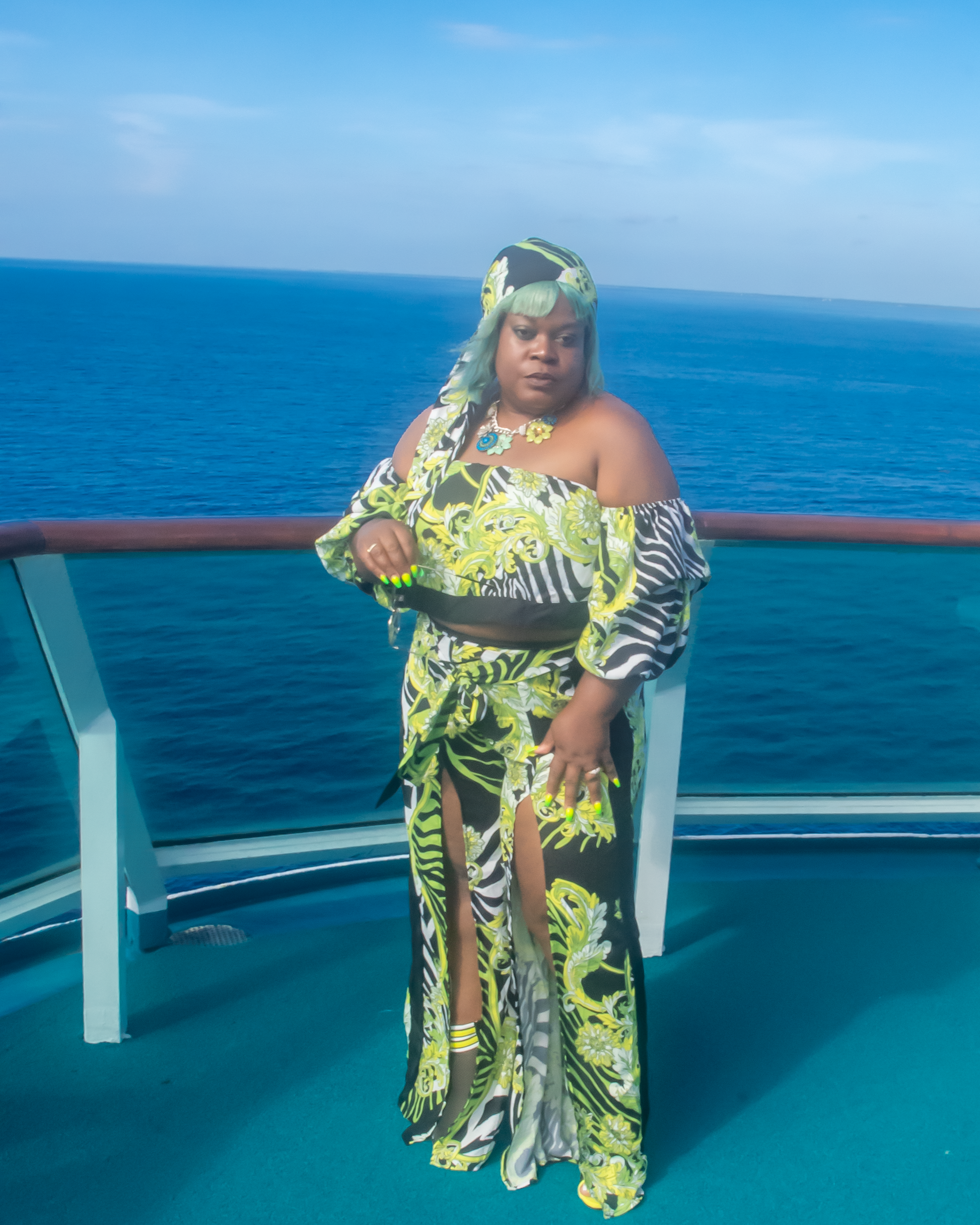 Off The Shoulder Zebra Print Romper Set 3/4  puffy sleeves with elastic, high waist, high slit flare pants showing off your sexy legs. also a matching head wrap, Neon Colors with Animal Prints.