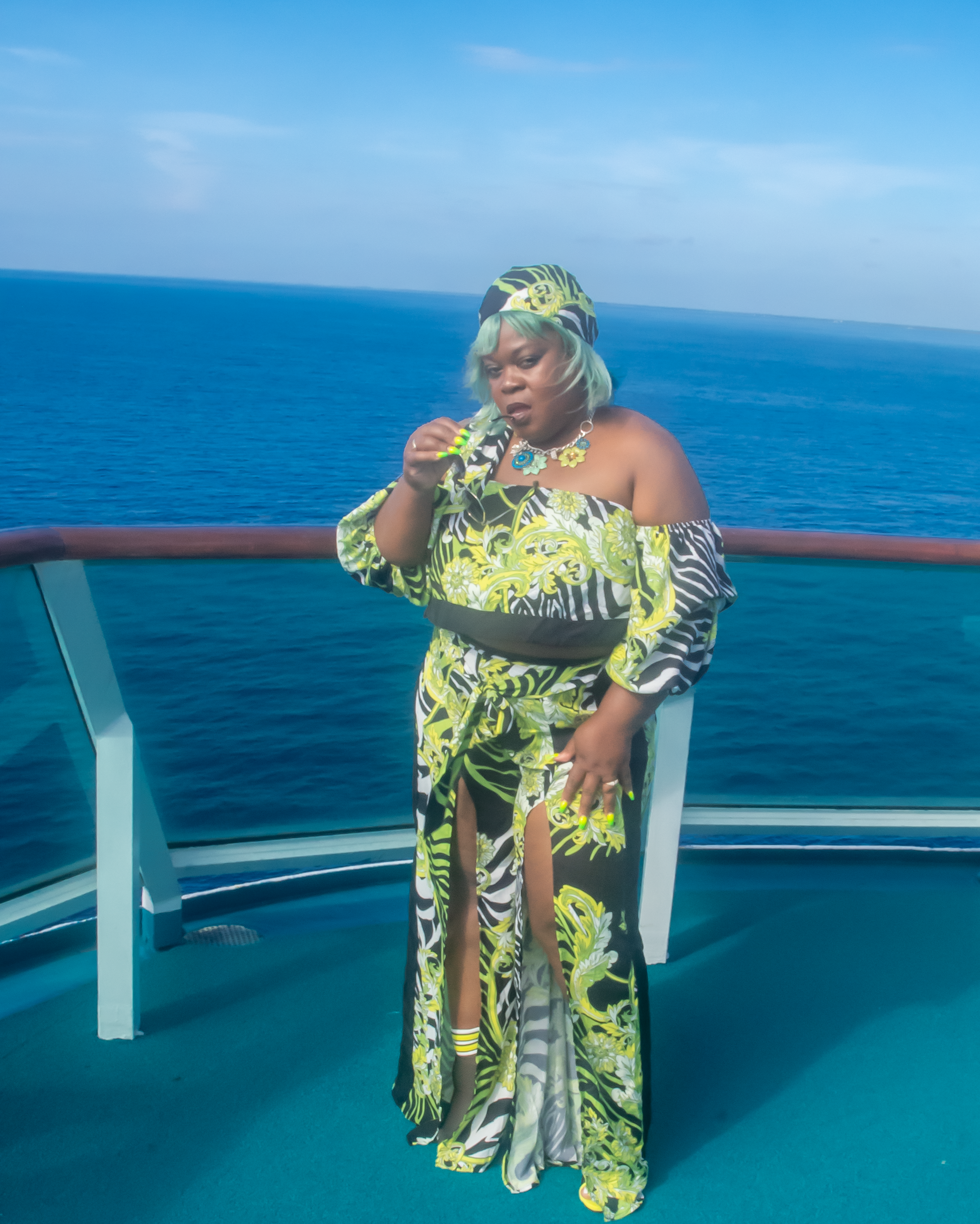 Off The Shoulder Zebra Print Romper Set 3/4  puffy sleeves with elastic, high waist, high slit flare pants showing off your sexy legs. also a matching head wrap, Neon Colors with Animal Prints.