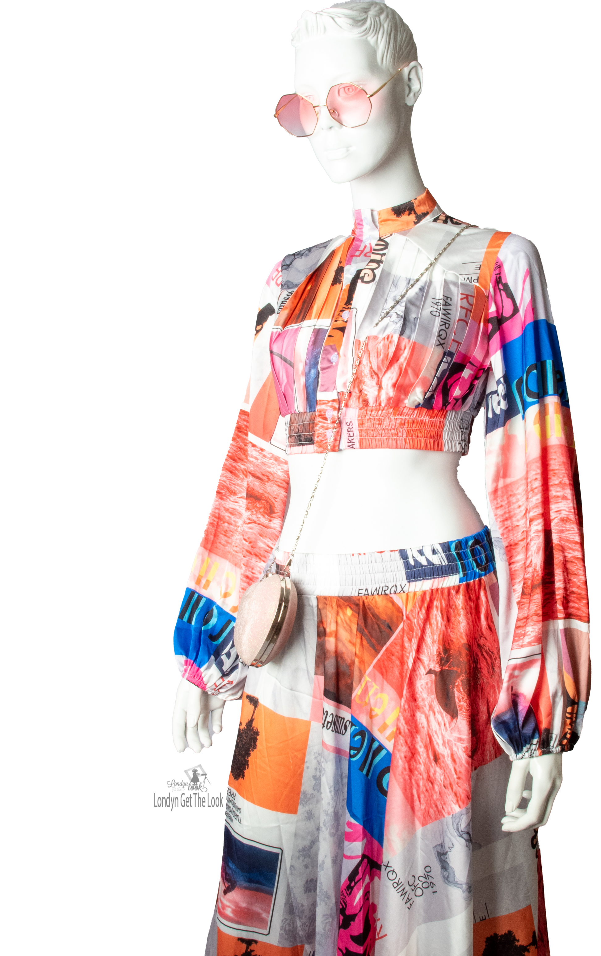 Long Sleeve Print Two Piece Set Top & Skirt featuring a button front top with pleated detail paired with matching dramatic flair maxi length skirt mock neck long puffy sleeve button-front closure with stunning shade of multi colors