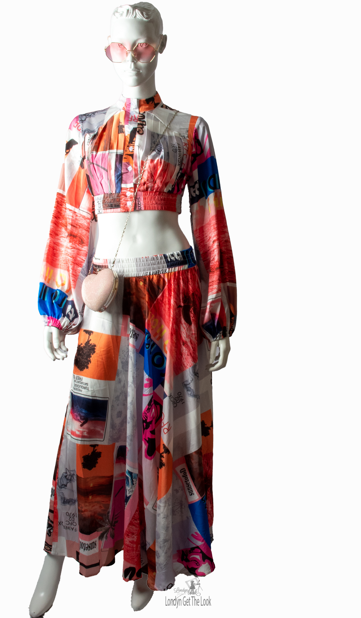 Long Sleeve Print Two Piece Set Top & Skirt featuring a button front top with pleated detail paired with matching dramatic flair maxi length skirt mock neck long puffy sleeve button-front closure with stunning shade of multi colors