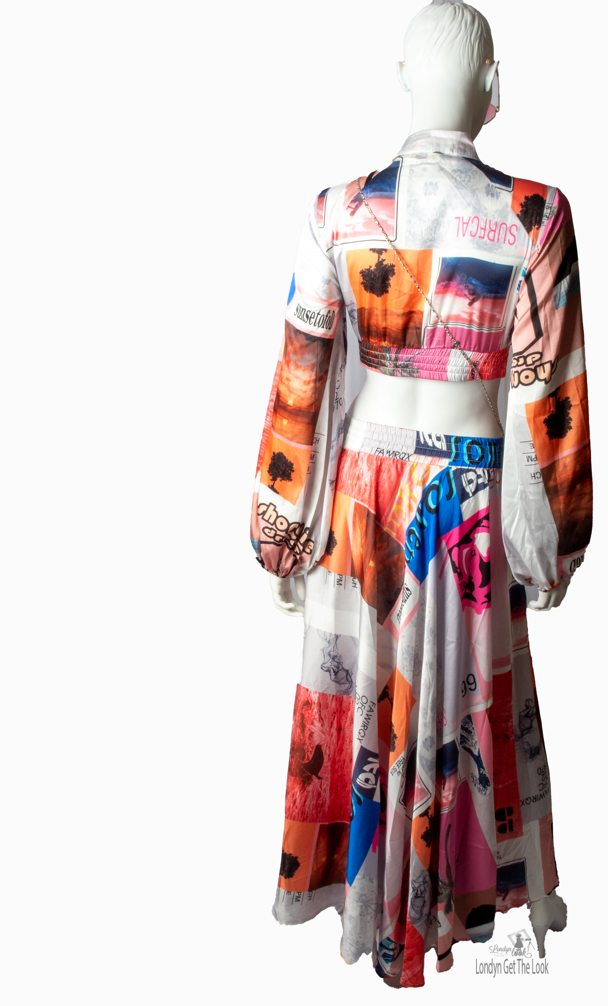 Long Sleeve Print Two Piece Set Top & Skirt featuring a button front top with pleated detail paired with matching dramatic flair maxi length skirt mock neck long puffy sleeve button-front closure with stunning shade of multi colors