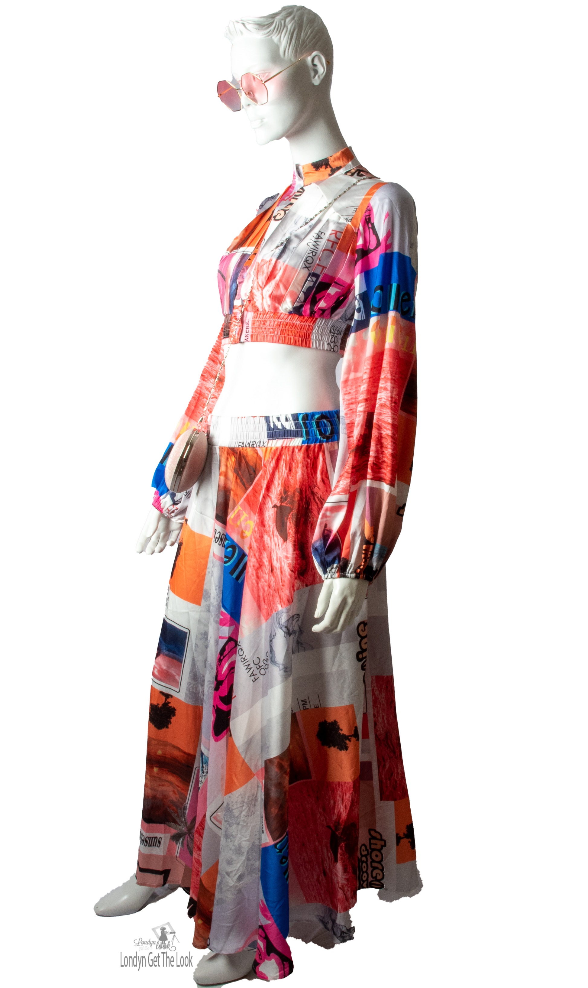 Long Sleeve Print Two Piece Set Top & Skirt featuring a button front top with pleated detail paired with matching dramatic flair maxi length skirt mock neck long puffy sleeve button-front closure with stunning shade of multi colors