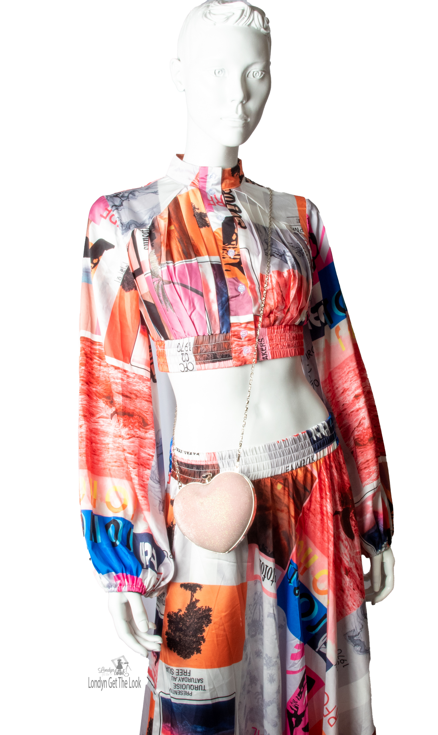 Long Sleeve Print Two Piece Set Top & Skirt featuring a button front top with pleated detail paired with matching dramatic flair maxi length skirt mock neck long puffy sleeve button-front closure with stunning shade of multi colors