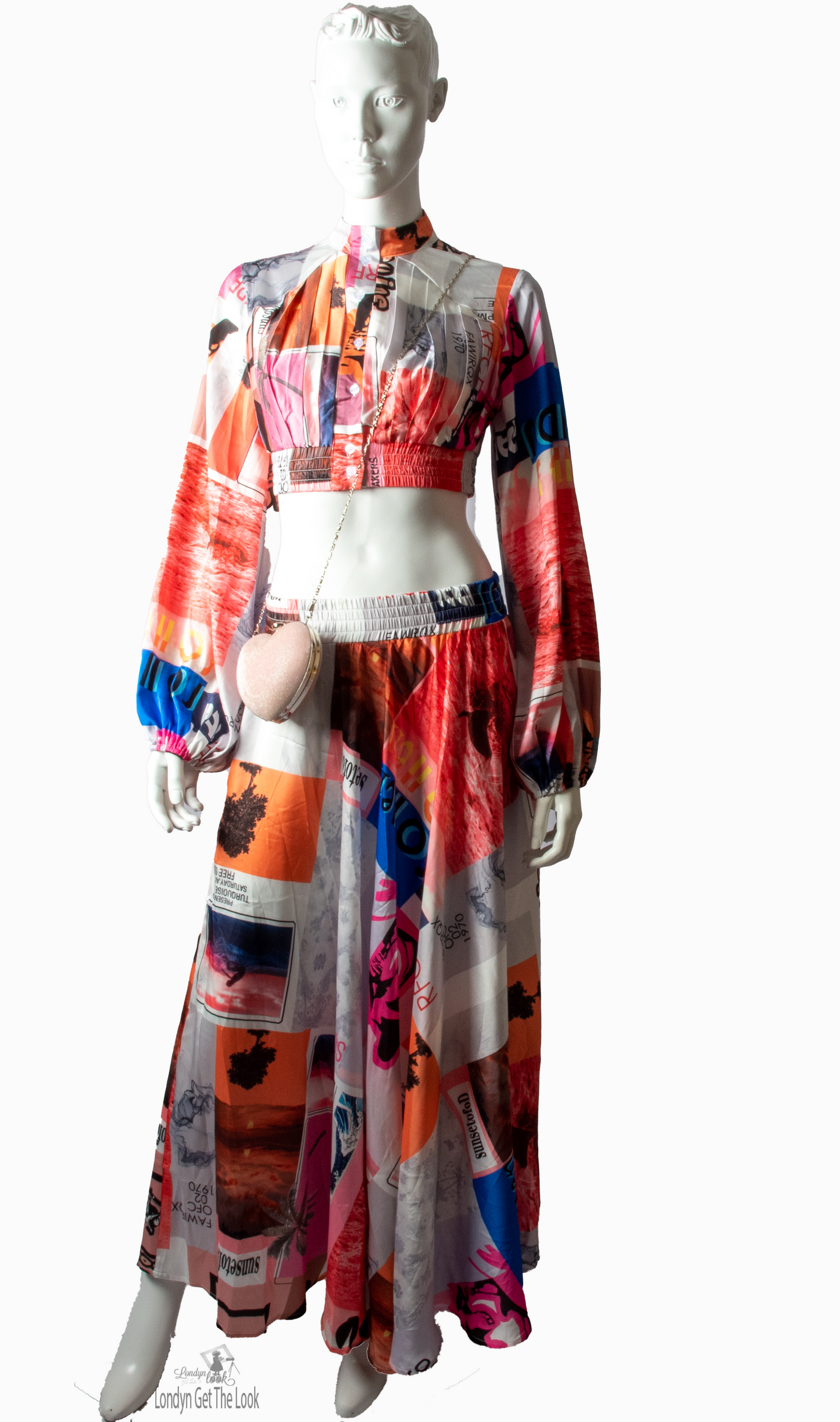 Long Sleeve Print Two Piece Set Top & Skirt featuring a button front top with pleated detail paired with matching dramatic flair maxi length skirt mock neck long puffy sleeve button-front closure with stunning shade of multi colors