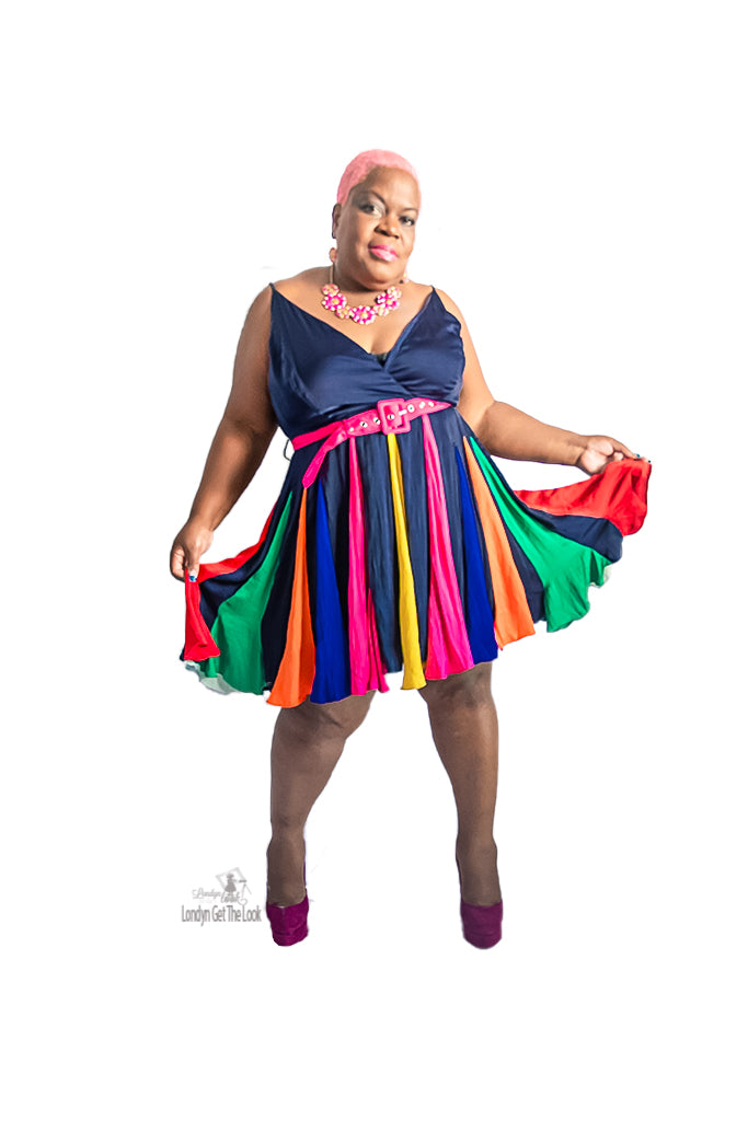 An elegant navy mini dress that comes in a soft silky fabric features a Burst of colorful gadget details on the skirt and comes with a detachable fuchsia belt. Invisible black zipper adjustable shoulder straps 