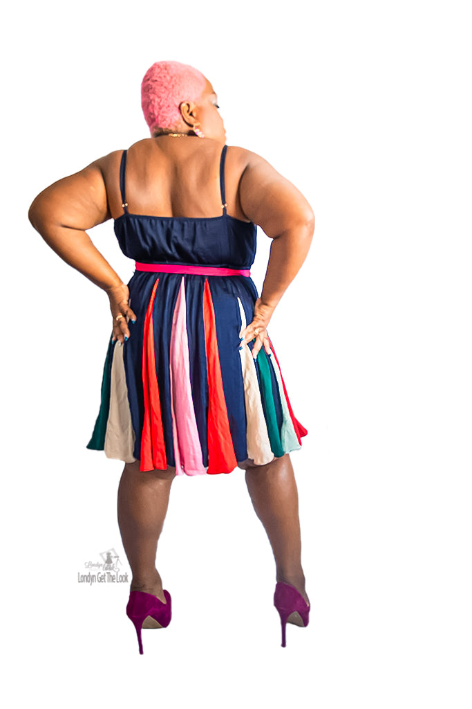 An elegant navy mini dress that comes in a soft silky fabric features a Burst of colorful gadget details on the skirt and comes with a detachable fuchsia belt. Invisible black zipper adjustable shoulder straps  