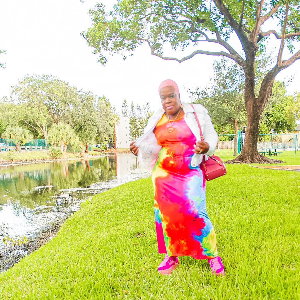 Our Candy Girl Tie-Dye Dress is amazing!  Straight ankle length, tank top detail featuring a u neckline, gorgeous multi color, has stretch the fabric hugs your curves, can be dressed up with heels or dress down with a denim Jacket and sneakers, can also accessories with jewelry and a small over the shoulder bag 